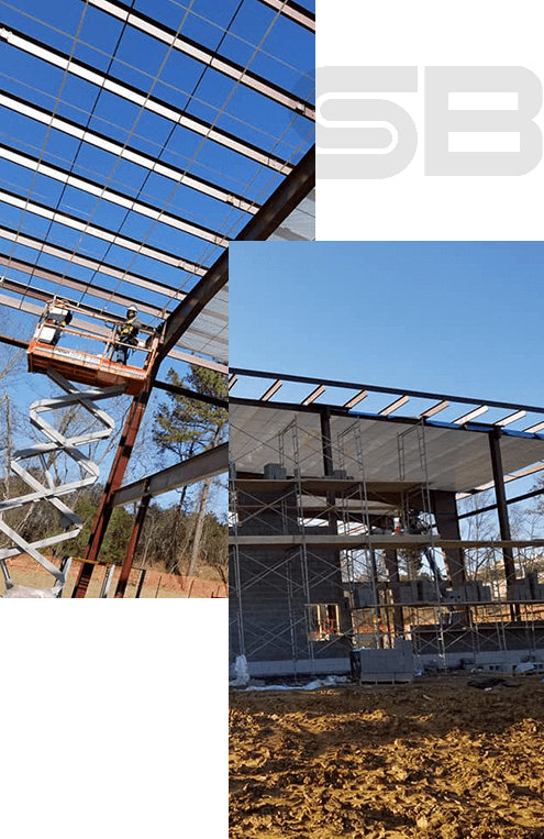 The interior of a big industrial building or factory with steel constructions